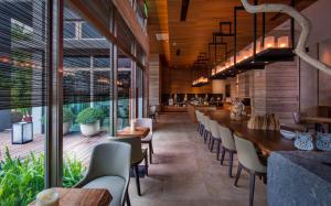 a dining room with a long table and chairs at Taroko Liiko Hotels in Xincheng