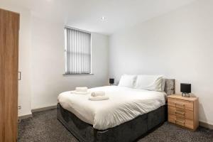 Ένα ή περισσότερα κρεβάτια σε δωμάτιο στο 1 Bed Budget Friendly Flat in Central Halifax