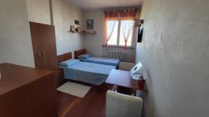 Postel nebo postele na pokoji v ubytování B&B - Camera doppia con bagno privato in stupendo attico con vista mozzafiato