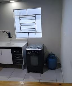 Kuchyň nebo kuchyňský kout v ubytování Osascoflats - Flats Mobiliados no Centro de Osasco/SP + 31 fotografií