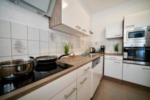 Køkken eller tekøkken på Wohnung mit 8 Schlafplätzen