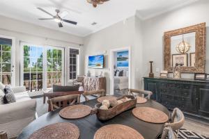 a living room with a table and chairs at Seacrest - The Wellington in Panama City Beach