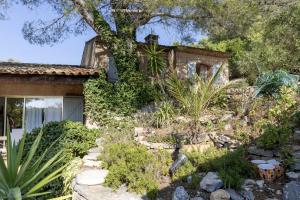 a stone house with a garden in front of it at Villa Ceyreste in Ceyreste