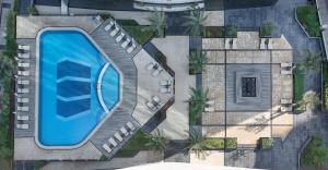 an overhead view of a swimming pool in a resort at Atana Hotel in Dubai