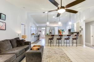 a living room with a couch and a table at Inviting Jensen Beach Home with Screened-In Patio! in Jensen Beach