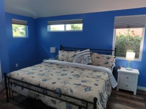 Postel nebo postele na pokoji v ubytování Hill Street Cottage