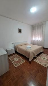 Postel nebo postele na pokoji v ubytování Corte Azzurra Iris