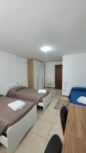 Postel nebo postele na pokoji v ubytování Corte Azzurra Iris