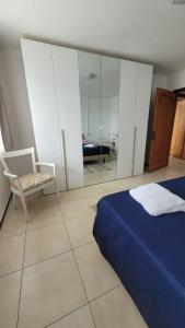 Postel nebo postele na pokoji v ubytování Corte Azzurra Iris