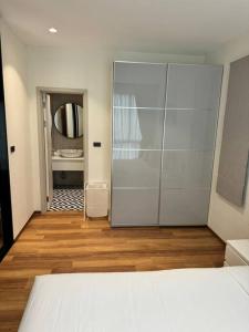 a bedroom with a bed and a bathroom with a mirror at Super Naiyang Title 1Bdr 600m to beach in Nai Yang Beach +13 photos