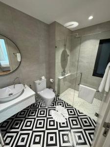 a bathroom with a sink and a toilet and a shower at Super Naiyang Title 1Bdr 600m to beach in Nai Yang Beach