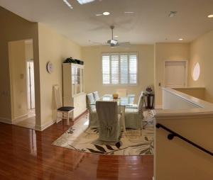 a dining room and living room with a table and chairs at Botanica Condo in Sarasota