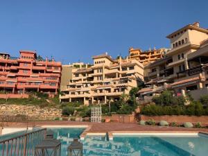 a resort with a swimming pool and some buildings at Penthouse Bonita Vista al Mar in Águilas