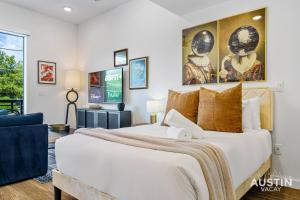 a bedroom with a large bed and a living room at Vibrant Austin Studio Balcony plus Parking and Wi-Fi in Austin