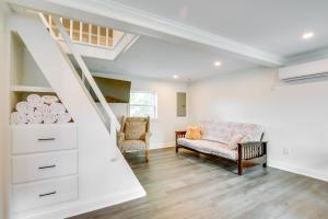 a living room with a staircase and a chair at Walk to Winery Holt Home 8 Mi to State Park! in Kearney