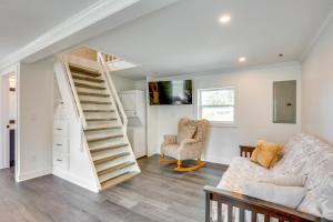a living room with a staircase and a couch at Walk to Winery Holt Home 8 Mi to State Park! in Kearney