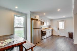 a kitchen with a stainless steel refrigerator and a table at Walk to Winery Holt Home 8 Mi to State Park! in Kearney +16 photos