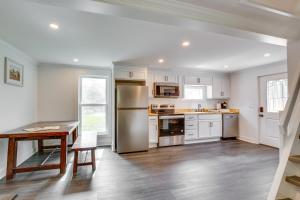 a kitchen with white cabinets and stainless steel appliances at Walk to Winery Holt Home 8 Mi to State Park! in Kearney