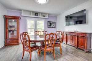 a kitchen with a dining room table and chairs at Walk to Winery Family-Friendly Holt Getaway in Kearney