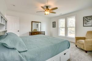 a bedroom with a bed and a ceiling fan at Walk to Winery Family-Friendly Holt Getaway in Kearney