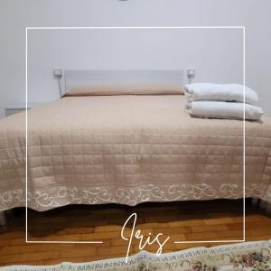 Postel nebo postele na pokoji v ubytování Corte Azzurra Iris