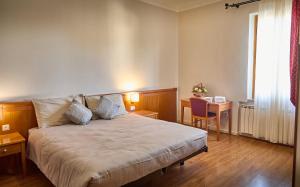 Postel nebo postele na pokoji v ubytování Sottoassisi - Guest House