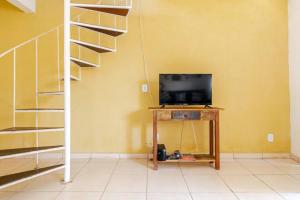 Et tv og/eller underholdning på Nossa_Casinha_Pé_na_Areia