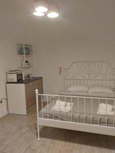 Ένα ή περισσότερα κρεβάτια σε δωμάτιο στο Residence e appartamenti Bausan +4 φωτογραφίες