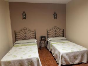 A bed or beds in a room at La Garzona