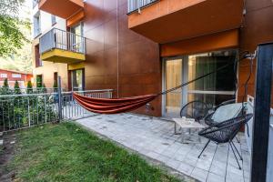 a hammock on the side of a building at Wise Nest Studio in Sinaia