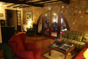 a living room with a couch and a table at Casa da Quinta De S. Martinho in Vila Real