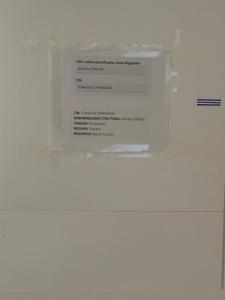 a white box with a sign on a wall at Casa Michele in Pontremoli