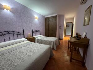 A bed or beds in a room at La Garzona
