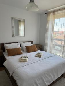 Ένα ή περισσότερα κρεβάτια σε δωμάτιο στο Apartament Ana