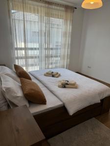 Ένα ή περισσότερα κρεβάτια σε δωμάτιο στο Apartament Ana
