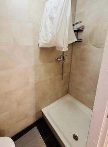 a bathroom with a shower with a toilet and a sink at Tallinn Downtown 1BR apartment with parking in Tallinn