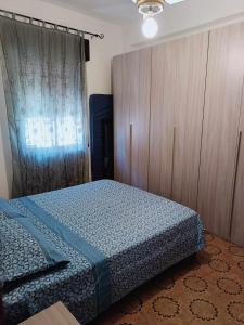 Ένα ή περισσότερα κρεβάτια σε δωμάτιο στο Casa Vacanza Loddo