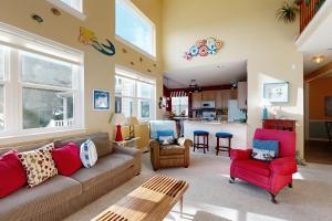 a living room with a couch and chairs and a kitchen at Wedgefield --- 23 Wedgefield in Ocean View