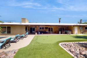 a house with a putting green in front of it at Geneva Drive Retreat in Tempe