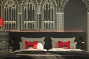Ein Bett oder Betten in einem Zimmer der Unterkunft Holiday Inn - the niu, Sparrow Regensburg by IHG