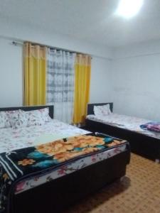 Sunset View Guest House客房内的一张或多张床位