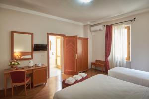 Postel nebo postele na pokoji v ubytování Sottoassisi - Guest House