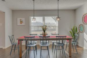 a dining room with a table and chairs at Dream Vacation Home with Pool for Large Groups in Garland