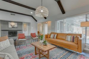 a living room with a couch and a table at Dream Vacation Home with Pool for Large Groups in Garland