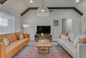 a living room with a couch and a table at Dream Vacation Home with Pool for Large Groups in Garland