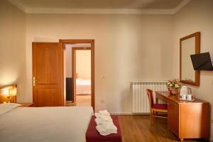 Postel nebo postele na pokoji v ubytování Sottoassisi - Guest House