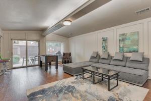 a living room with a couch and a table at Spacious and Modern Home with Private Pool in Plano +37 photos