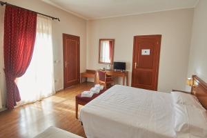 Postel nebo postele na pokoji v ubytování Sottoassisi - Guest House