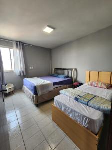 Postel nebo postele na pokoji v ubytování 1102 Apto Inteiro - Área Central