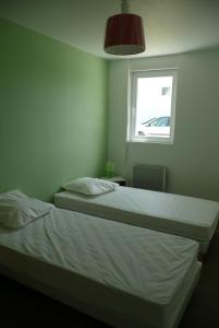 Cama o camas de una habitación en Résidence Saint-Yves